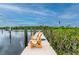 Relaxing dockside chairs overlooking the peaceful waterway at 5480 Sea Edge Dr, Punta Gorda, FL 33950