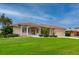 Single-story home with attached garage and manicured lawn at 5480 Sea Edge Dr, Punta Gorda, FL 33950