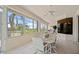 Sunroom with water views and a large table for dining at 5480 Sea Edge Dr, Punta Gorda, FL 33950