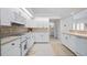 Bright kitchen with white cabinets, tile backsplash, and modern appliances at 5480 Sea Edge Dr, Punta Gorda, FL 33950