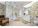 Bathroom with walk-in shower, soaking tub, and floral wallpaper at 5480 Sea Edge Dr, Punta Gorda, FL 33950