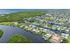 Aerial view of waterfront property with lush landscaping at 5480 Sea Edge Dr, Punta Gorda, FL 33950