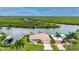 Canal front home with lush landscaping and tropical views at 5480 Sea Edge Dr, Punta Gorda, FL 33950