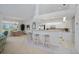 Bright kitchen featuring white cabinets and a breakfast bar at 5480 Sea Edge Dr, Punta Gorda, FL 33950