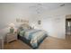 Spacious bedroom with a large bed and en-suite bathroom access at 5480 Sea Edge Dr, Punta Gorda, FL 33950