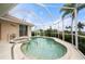 Inviting screened pool and spa with tranquil water views at 5480 Sea Edge Dr, Punta Gorda, FL 33950