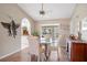 Elegant dining area with glass-top table and kitchen access at 994 Messina Dr, Punta Gorda, FL 33950