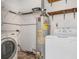 Laundry room with washer, dryer, and water heater at 3107 Easy St, Port Charlotte, FL 33952