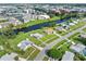 Aerial view showcasing a home's location near a canal and other properties at 3107 Easy St, Port Charlotte, FL 33952