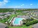 Community pool with surrounding lounge chairs and bocce ball at 43614 Sparrow Dr, Punta Gorda, FL 33982