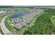 Aerial view of community with lakefront villas and lush landscaping at 43614 Sparrow Dr, Punta Gorda, FL 33982