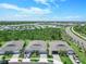 Community view showcasing homes, landscaping, and roads at 43614 Sparrow Dr, Punta Gorda, FL 33982