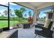 Relaxing screened porch overlooking a grassy backyard at 43614 Sparrow Dr, Punta Gorda, FL 33982