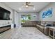 Spacious living room with sectional sofa and fireplace at 43614 Sparrow Dr, Punta Gorda, FL 33982