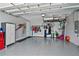 Organized garage with overhead storage and epoxy flooring at 43614 Sparrow Dr, Punta Gorda, FL 33982