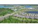 Aerial view of community featuring a golf course, lakes, and luxury villas at 43614 Sparrow Dr, Punta Gorda, FL 33982