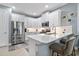 Modern kitchen with stainless steel appliances and white cabinetry at 43614 Sparrow Dr, Punta Gorda, FL 33982