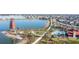 Community overview featuring a lake, clock tower, and resort amenities at 43614 Sparrow Dr, Punta Gorda, FL 33982