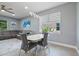 Dining area with modern table and chairs, near living room at 43614 Sparrow Dr, Punta Gorda, FL 33982
