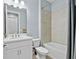 Clean bathroom with a bathtub, toilet and single vanity at 43614 Sparrow Dr, Punta Gorda, FL 33982