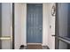 Dark blue front door entry with a monogram at 43614 Sparrow Dr, Punta Gorda, FL 33982