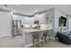 Modern kitchen with stainless steel appliances and white cabinetry at 43614 Sparrow Dr, Punta Gorda, FL 33982