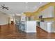 Updated kitchen, featuring white shaker cabinets, stainless steel appliances, and hardwood floors at 1639 Nuremberg Blvd, Punta Gorda, FL 33983