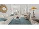 Bright and airy living room with comfortable seating and large windows at 14176 Saul Ln, Port Charlotte, FL 33981