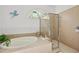 Bathroom with soaking tub and walk-in shower at 14176 Saul Ln, Port Charlotte, FL 33981