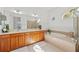 Double vanity bathroom with soaking tub at 14176 Saul Ln, Port Charlotte, FL 33981