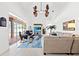 Spacious living room with pool views and a large sectional sofa at 14176 Saul Ln, Port Charlotte, FL 33981