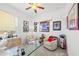Bright office space with two comfy chairs and hockey memorabilia at 14176 Saul Ln, Port Charlotte, FL 33981