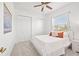 Bright bedroom with a queen-size bed, large closet, and window coverings at 14176 Saul Ln, Port Charlotte, FL 33981