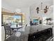 Modern kitchen with granite countertops and breakfast bar overlooking pool at 14176 Saul Ln, Port Charlotte, FL 33981
