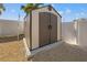 Exterior shed provides additional storage for yard tools at 14176 Saul Ln, Port Charlotte, FL 33981