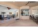 Covered patio with seating and view of the living room at 14176 Saul Ln, Port Charlotte, FL 33981