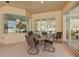 Outdoor patio with a table and chairs, perfect for dining al fresco at 14176 Saul Ln, Port Charlotte, FL 33981