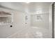 Spacious bedroom with two windows and tile floor at 1642 Banyan Dr, Venice, FL 34293