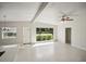 Bright living room features a large window, offering natural light and backyard view at 1642 Banyan Dr, Venice, FL 34293