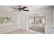 Bedroom with mirrored closet doors opening to a sunroom at 1642 Banyan Dr, Venice, FL 34293