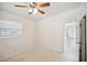 Bright and airy bedroom with ceiling fan and window blinds at 1642 Banyan Dr, Venice, FL 34293