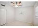 Cozy bedroom with ceiling fan and window at 1642 Banyan Dr, Venice, FL 34293