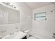 Clean bathroom with a bathtub, shower, and updated vanity at 1642 Banyan Dr, Venice, FL 34293