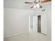 Bright bedroom with ceiling fan and closet at 1642 Banyan Dr, Venice, FL 34293
