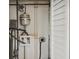 Laundry and utilities area with water heater and plumbing at 1642 Banyan Dr, Venice, FL 34293