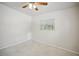 Spacious bedroom with ceiling fan and window at 1642 Banyan Dr, Venice, FL 34293