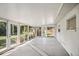 Spacious sunroom featuring glass doors and backyard access at 1642 Banyan Dr, Venice, FL 34293