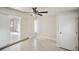 Bedroom with access to another room and tile floor at 1642 Banyan Dr, Venice, FL 34293