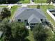 House with grey roof, paved patio, and a screened-in porch at 3721 Monday Ter, North Port, FL 34286