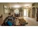 Living room features a brown leather couch and dining area at 3721 Monday Ter, North Port, FL 34286